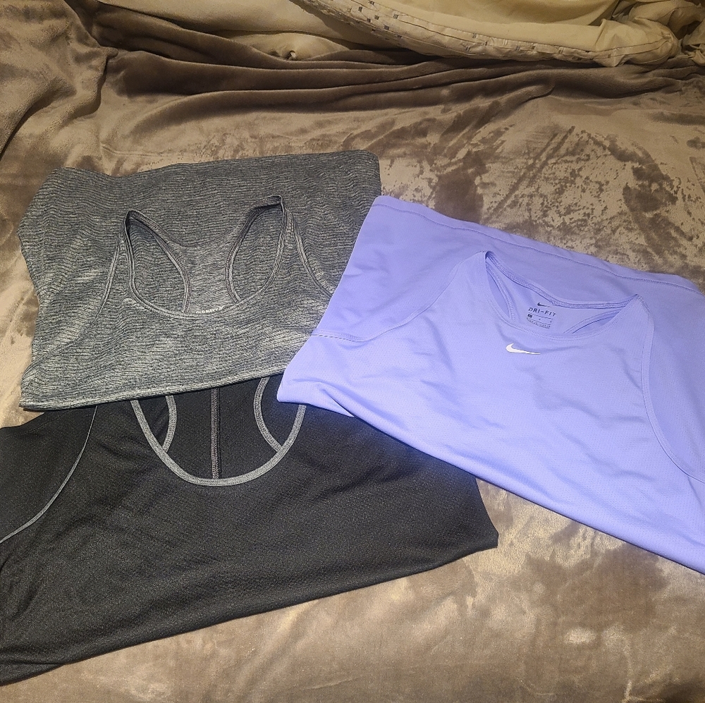 3 racer back athletic tanks.  2 are from old navy and one is Nike.